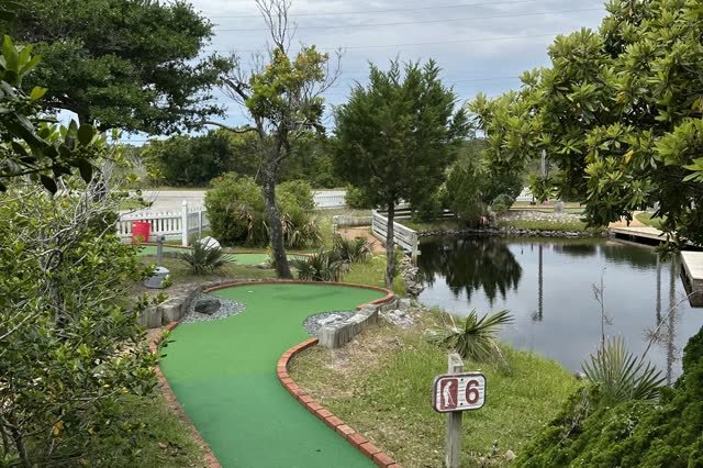 Hole 6 mini golf fairway beside the pond at Frisco Mini Golf Outer Banks